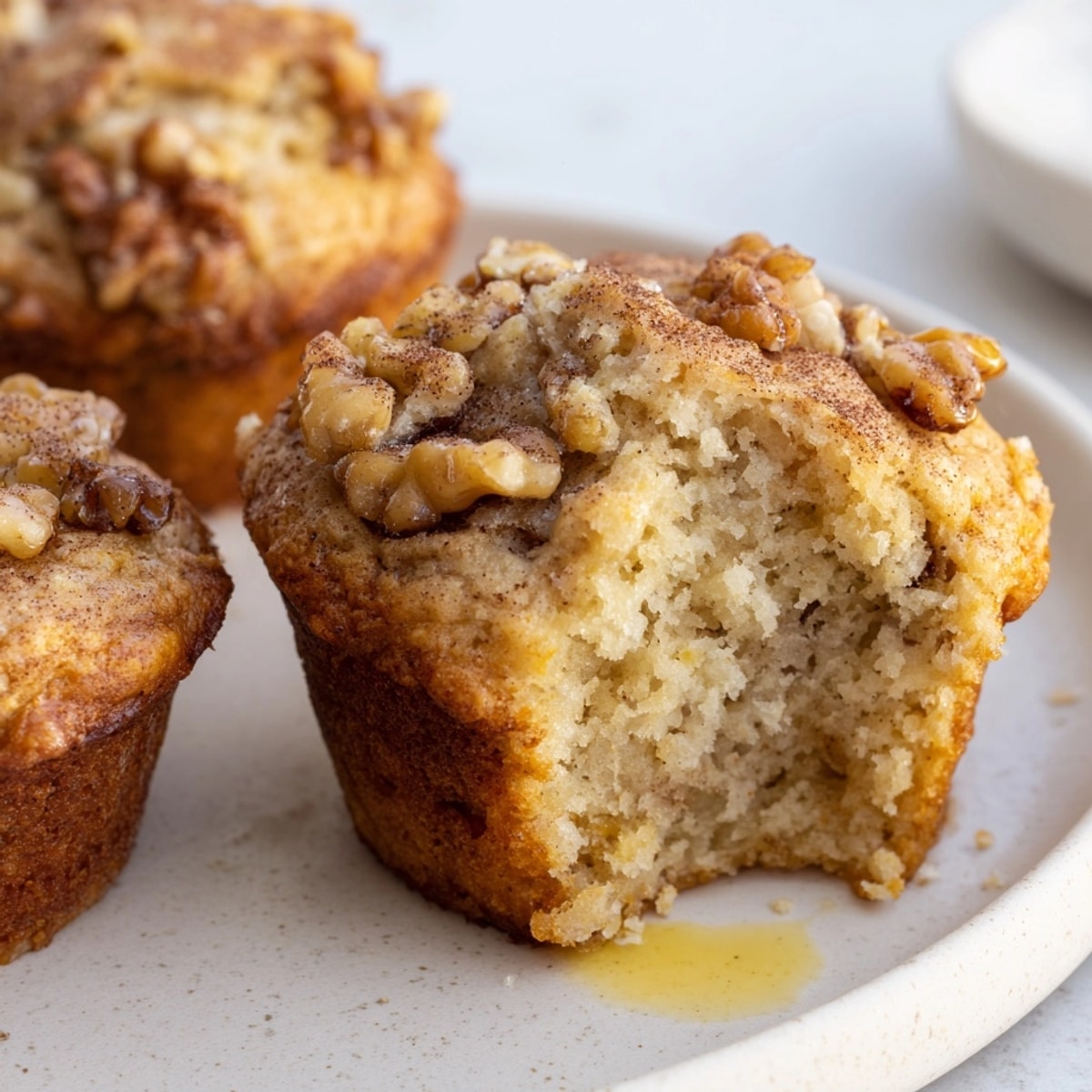 Warm, fragrant Banana Nut Muffins cooling on a rack, ready for morning coffee.