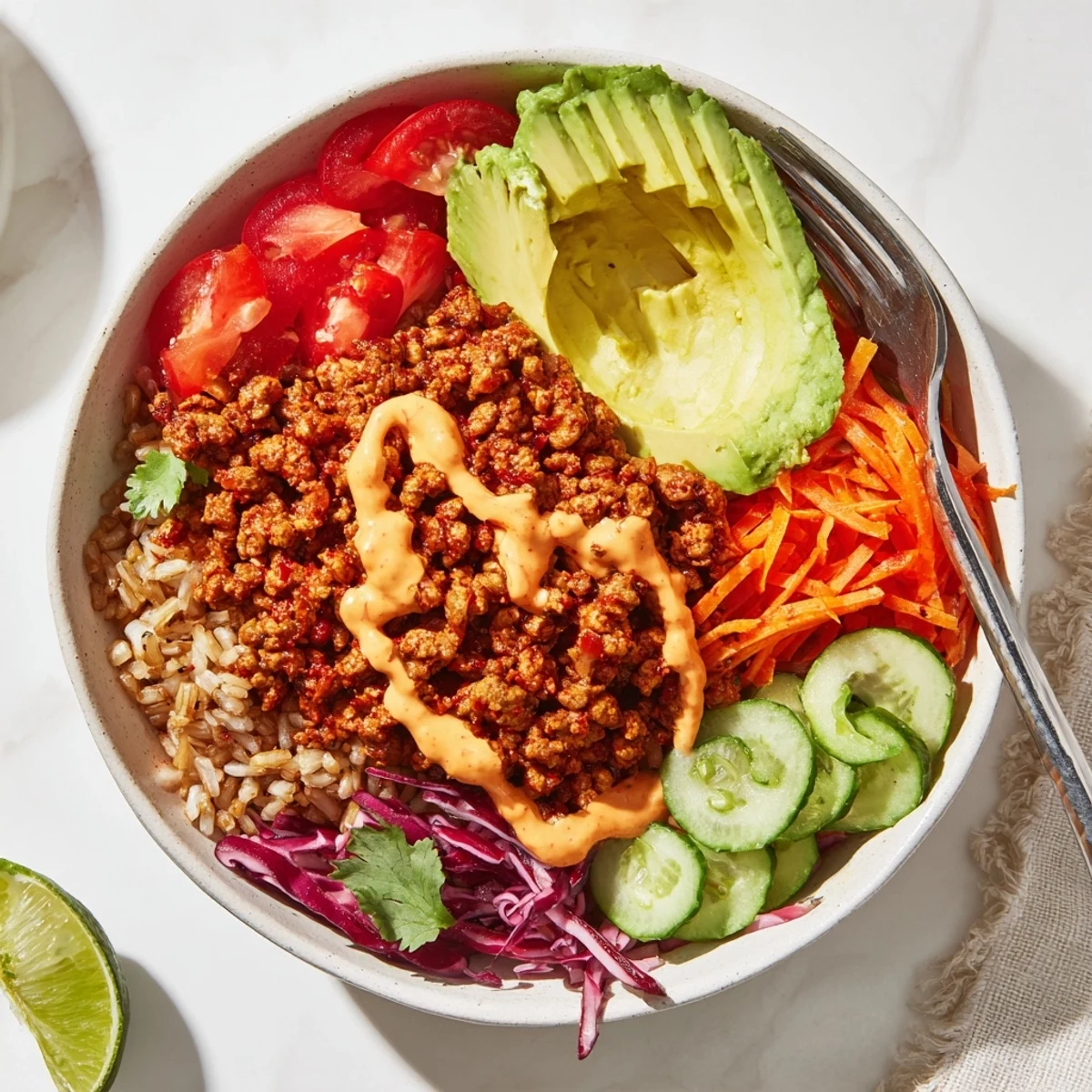A colorful Plant-Based Meat Bowl topped with fresh vegetables and spices.  