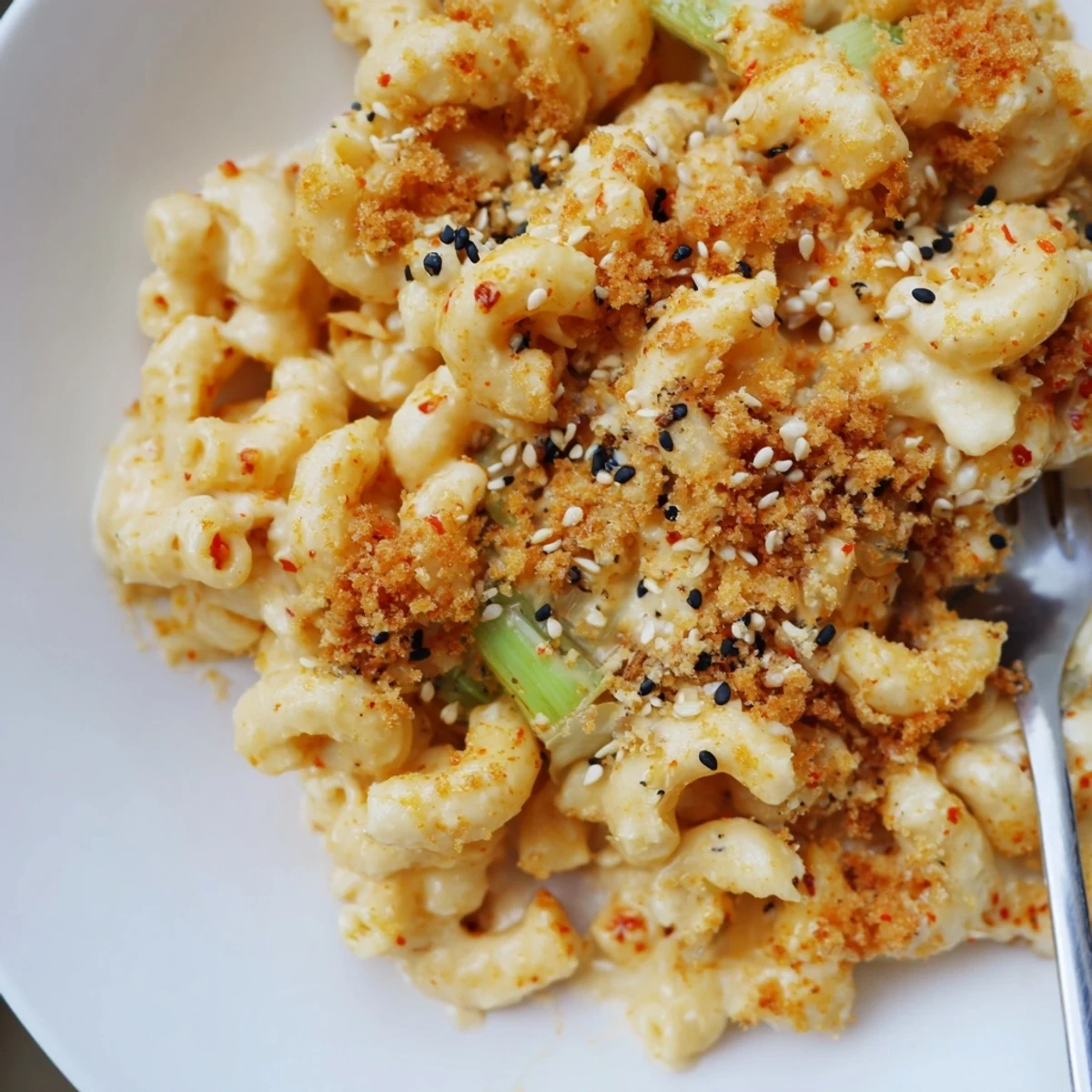Creamy Spicy Kimchi Mac & Cheese topped with crunchy panko and sesame seeds.