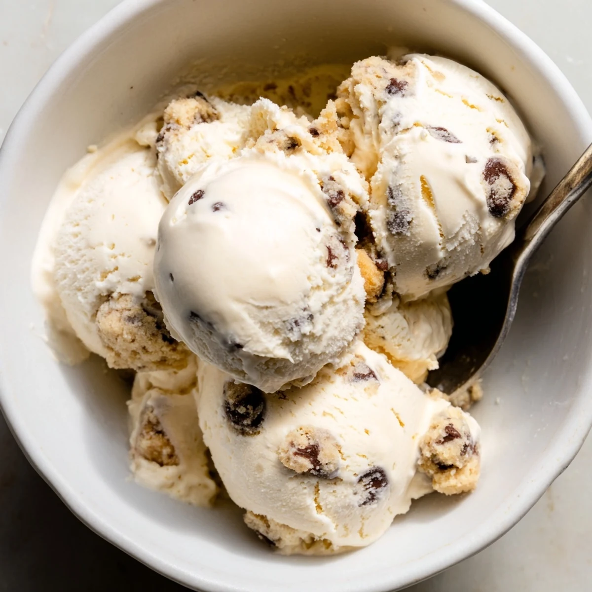Indulge in homemade cottage cheese ice cream studded with sweet cookie dough chunks.  