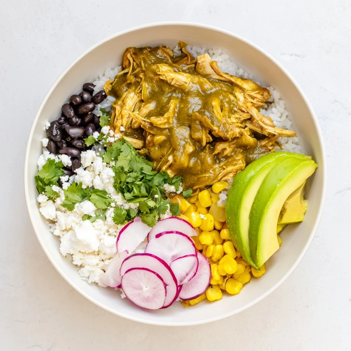 Steaming Green Enchiladas Rice Bowl overflowing with chicken, fresh toppings, and vibrant flavors to enjoy.