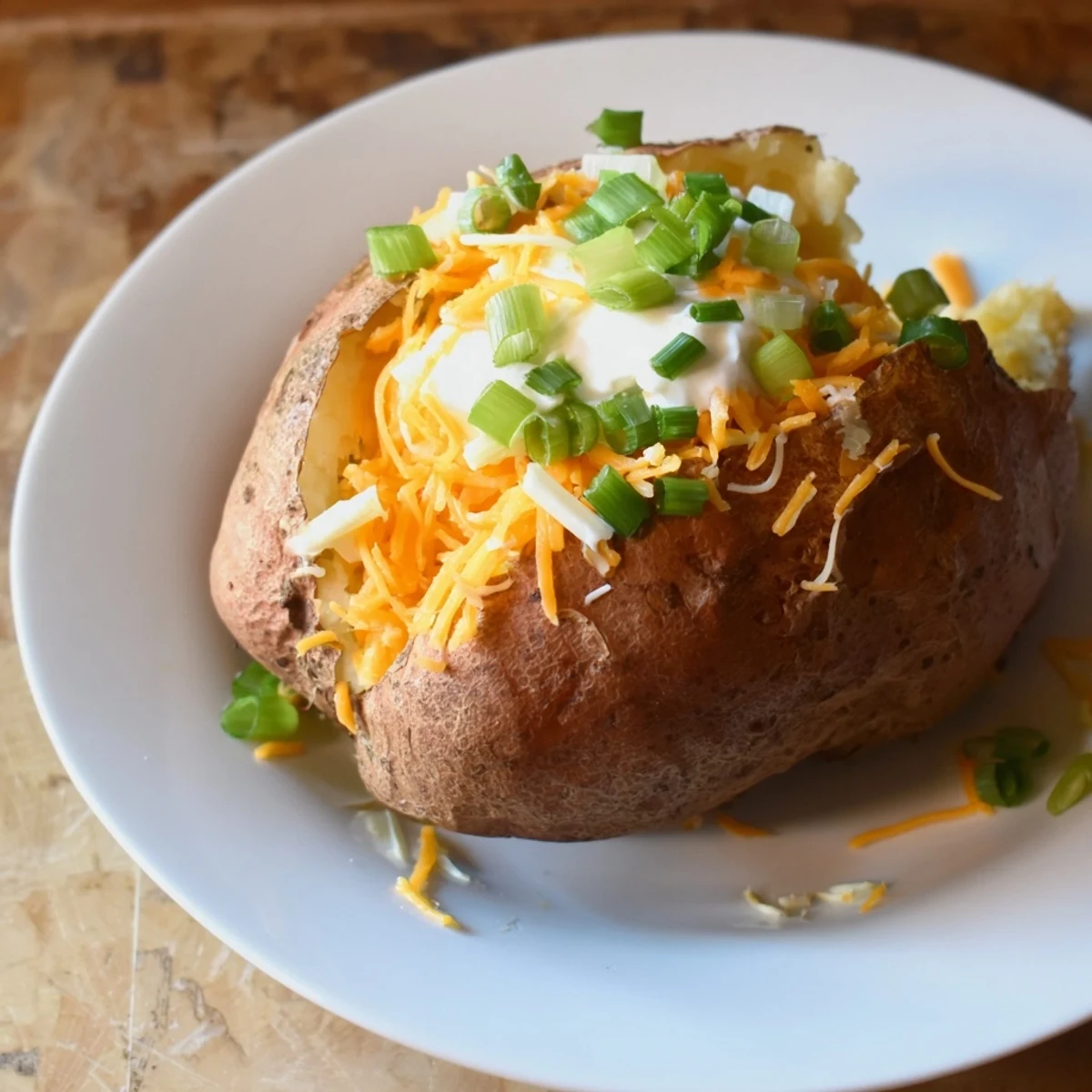 Loaded baked potatoes, fluffy inside and crispy outside, are the star of this easy, customizable potato bar feast.