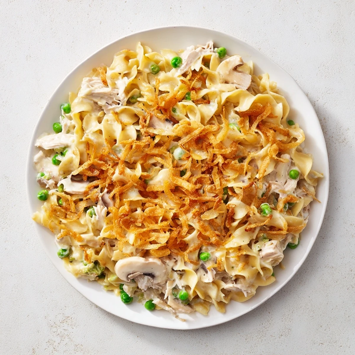 Creamy Tuna Noodle Casserole with a golden crust, bubbly from the oven and ready to serve.
