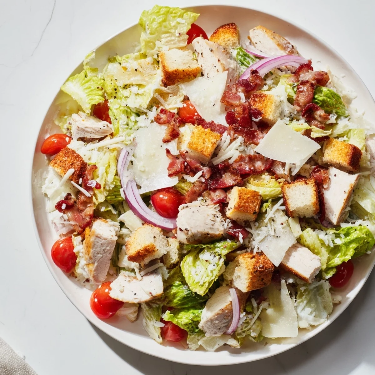 Enjoy a close-up of this flavorful Costco Chicken Bake Salad Bowl piled high with toppings.