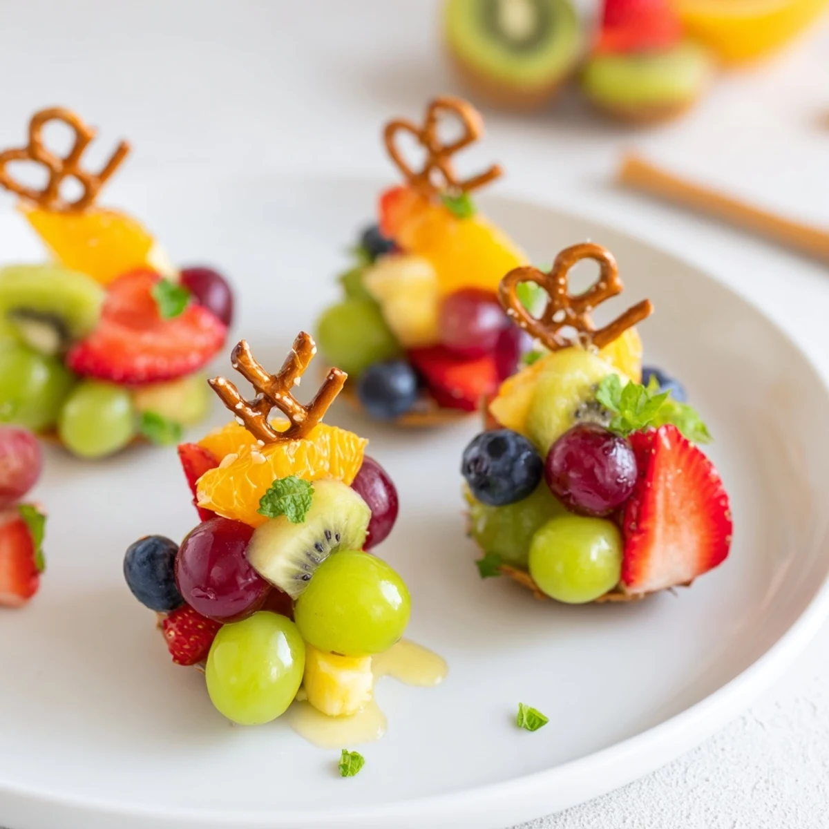 Festive Ornament Fruit Medley, a delightful mix of grapes, kiwi, and berries, beautifully presented for serving.
