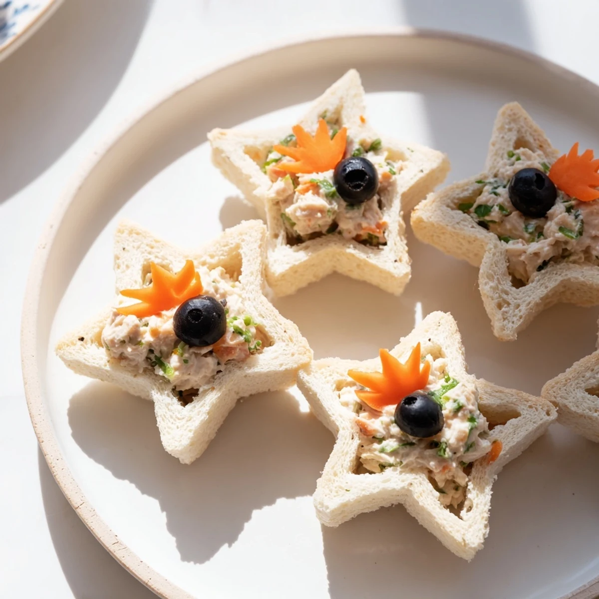 Mini Starfish Sandwiches plated, showing playful tuna filling between soft bread, ready to enjoy.