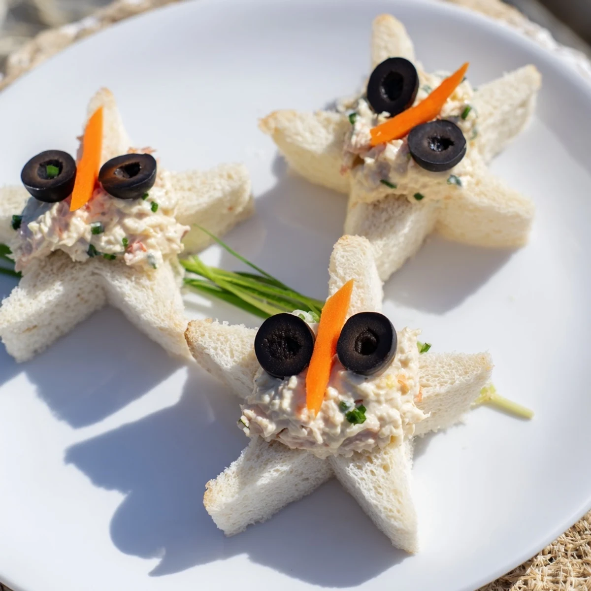 These irresistible Mini Starfish Sandwiches feature olive eyes and caper details, ready for a party.