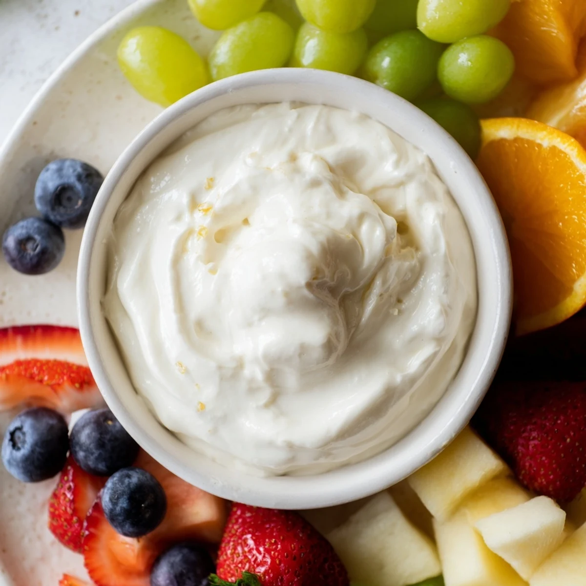 A close-up of a delightful cream cheese fruit dip, ready to be enjoyed with seasonal fruit.