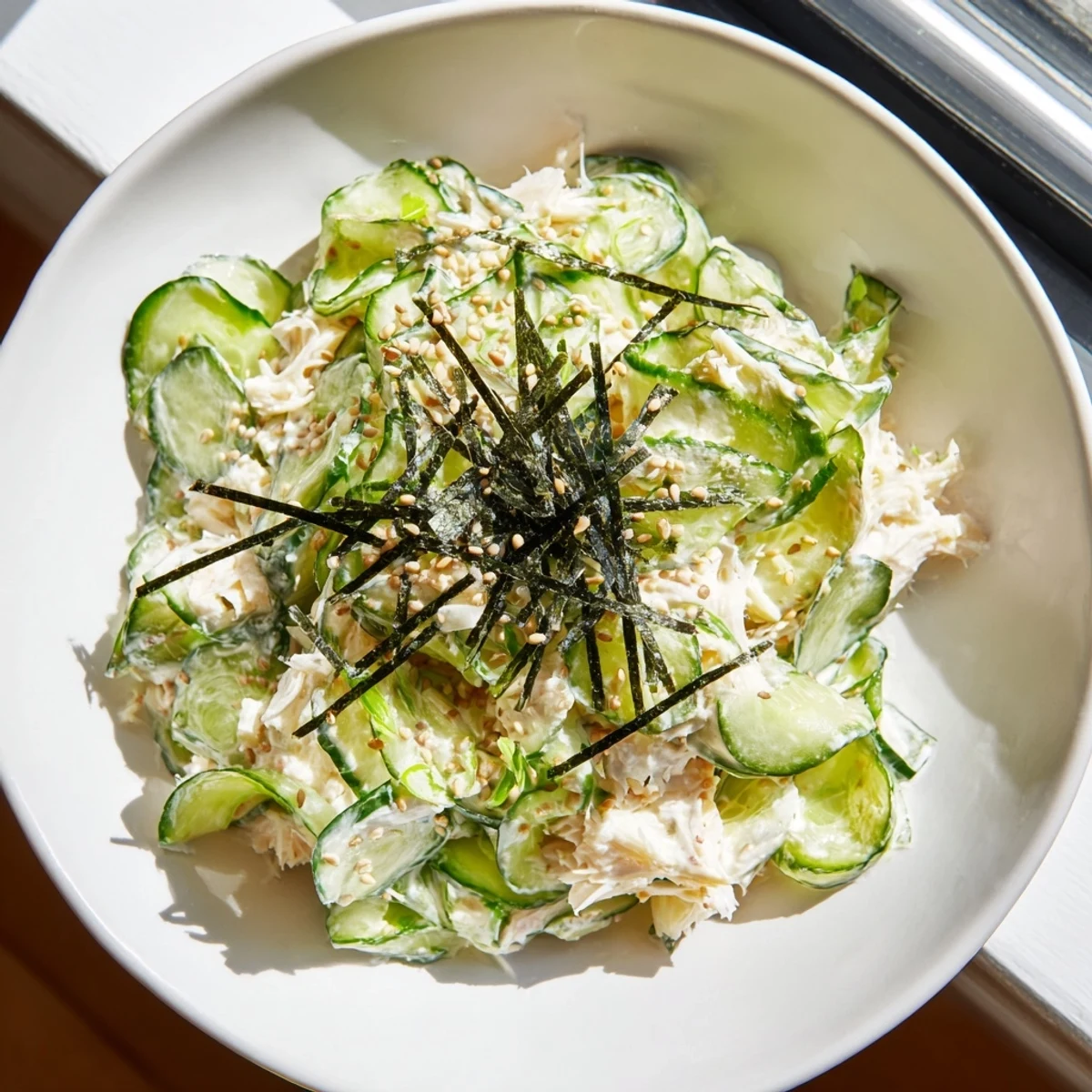 California Roll Cucumber Salad, a vibrant mix of cucumbers, crab, and creamy dressing, ready to enjoy.