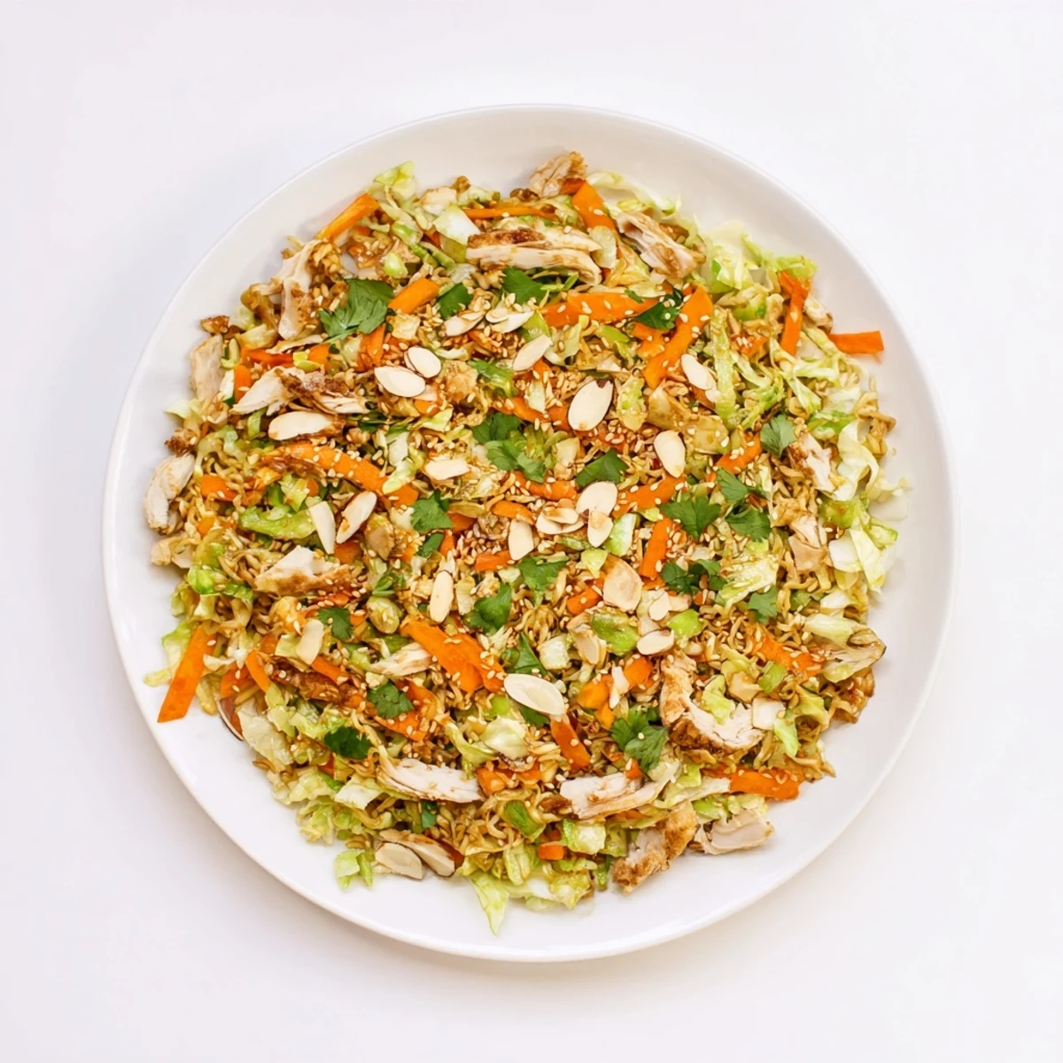 Shredded cabbage, rotisserie chicken, and crushed ramen noodles tossed in a sweet sesame dressing for a quick lunch.