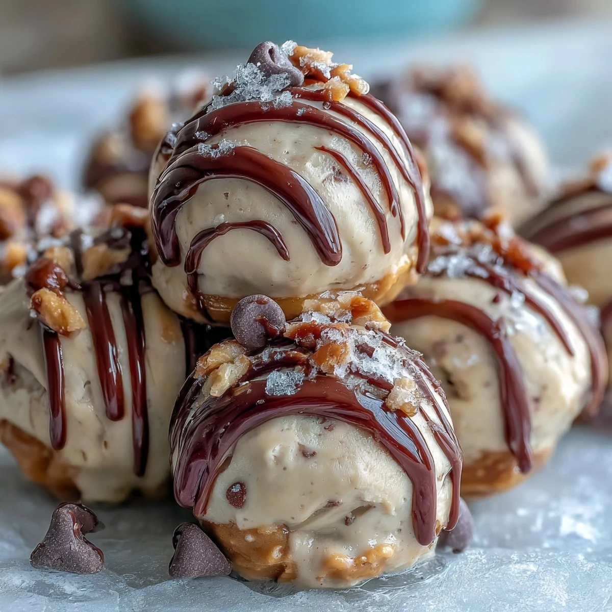 Homemade frozen Greek yogurt peanut butter bites topped with chia seeds, ideal for healthy snacking or dessert.
