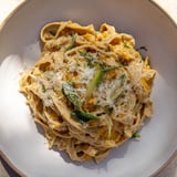 A bowl of savory Healthy Creamy Pumpkin Sage Pasta, rich with pumpkin and fresh herbs.