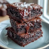 Decadent brownies made with bittersweet, milk, and semi-sweet chocolate, enhanced by tangy sourdough discard for chewy perfection.  