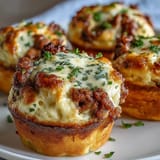 Savory comfort food bites: rich meat and vegetable filling baked under a layer of buttery mashed potatoes in muffin cups.  
