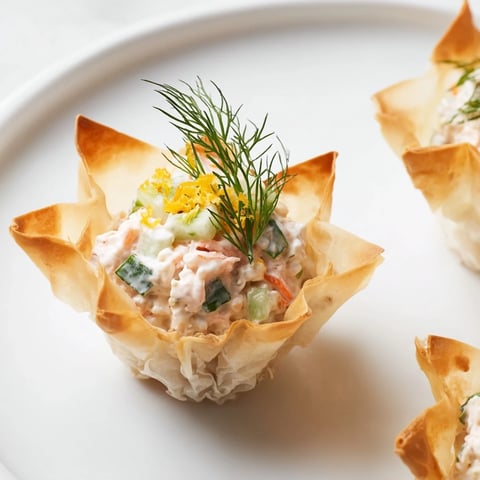 Golden, crispy Mini Star Cocktail Cups filled with chilled shrimp salad, ready for serving.