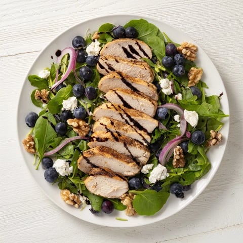 Blueberry Goat Cheese Chicken Salad, overflowing with fresh ingredients and drizzled balsamic glaze.