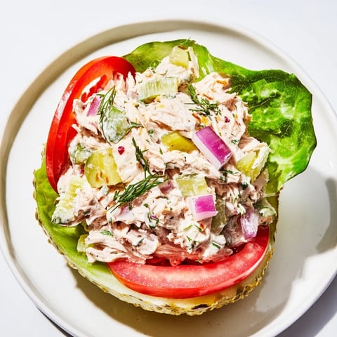 Savory pickle sandwich loaded with creamy chicken salad and fresh, crisp dill for lunch.