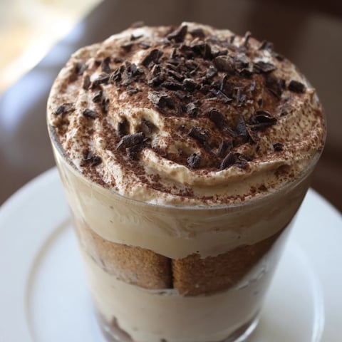 Rich Tiramisu Latte with layers of espresso-soaked biscuits and creamy mascarpone, ready to enjoy.
