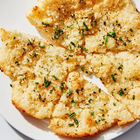 Fluffy golden-brown cloud bread savory toasts with herbs, ready to be enjoyed with a dipping sauce.