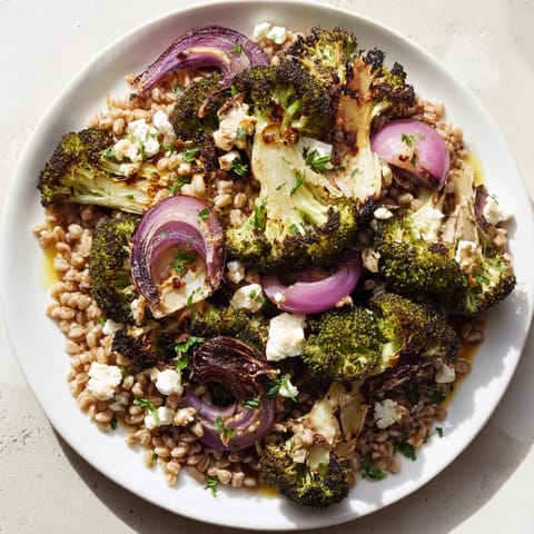 Sizzling warm roasted broccoli sits atop a nutty farro base, drizzled with lemon-herb dressing.