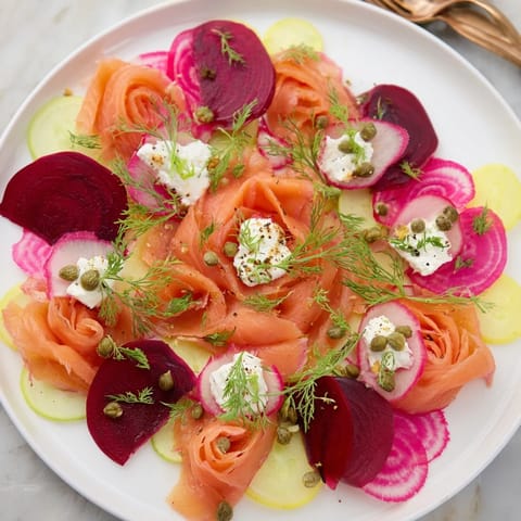Close-up of a festive Winter Harvest Smoked Salmon Board with colorful garnishes and crackers ready to enjoy.