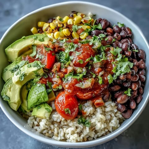Colorful, healthy plant-based taco bowl loaded with vibrant veggies and black beans.