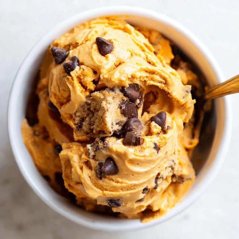 Lusciously smooth pumpkin chocolate chip muffin ice cream, perfect for autumn desserts.  