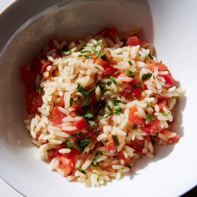 Fragrant and colorful, this flavorful Tomato-Rice Skillet Dinner promises a comforting and delicious vegetarian meal.