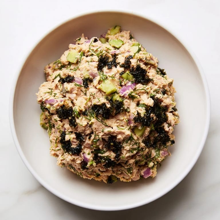 View a close-up image of the delicious chickpea tuna salad, perfect on whole grain bread.