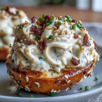Creamy Everything Bagel Deviled Eggs with a sprinkle of savory topping.